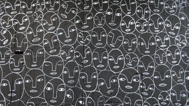 Repeating faces - Photo by Joanjo Pavon on Unsplash