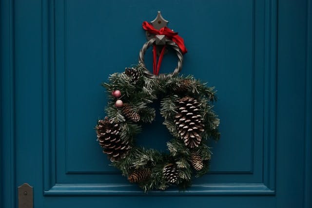 Christmas wreath on door - Photo by Erwan Hesry on Unsplash