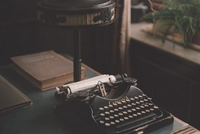 Typewriter on desk - ask a ghostwriter - Photo by Daria Kraplak on Unsplash