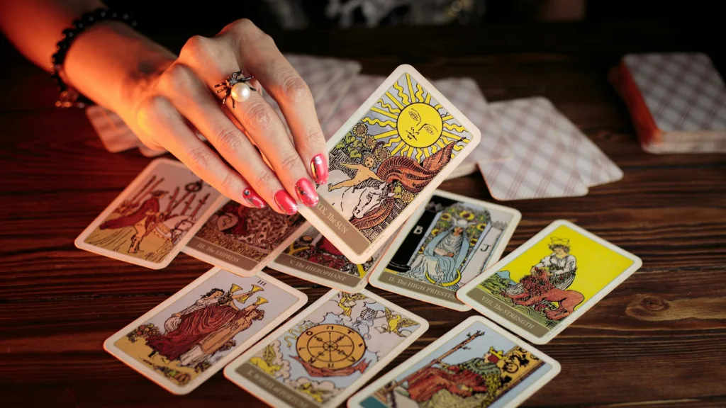 A tarot reader doing prophecy through divination - Photo by petr sidorov on Unsplash