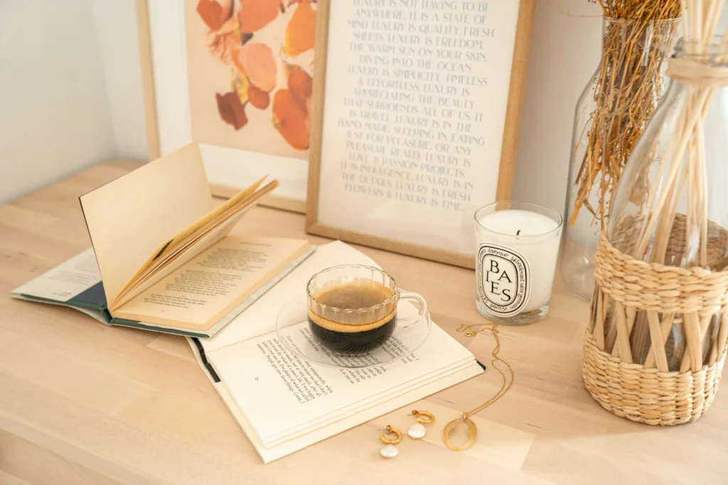 Cosy fiction on a desk with a cup of coffee - Photo by Alisa Anton on Unsplash

